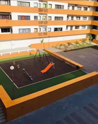 a building with a playground in front of a building at Apartamento Mi in Praia