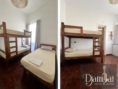 two bunk beds in a room with a room with at Hostel Djambai in Mindelo