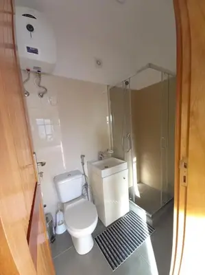 a small bathroom with a toilet and a shower at One cozy bedroom - Studio in Santa Maria in Santa Maria