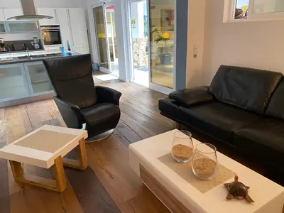 a living room with a couch and a table at Zweite Heimat - Townhouse Boa Vista in Sal Rei