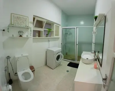 a bathroom with a toilet and a shower and a sink at Flat Mindelo Deluxe 30 in Mindelo