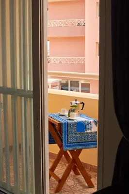 a table with a sewing machine sitting on top of it at La Piazza in Santa Maria