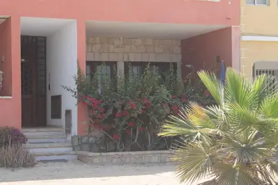 a house with a bunch of flowers in front of it at Casa Mar Doce in Sal Rei