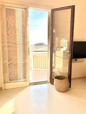 a living room with a large sliding glass door at Casa da Leoa in Sal Rei