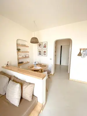 a living room with a couch and a table at Casa da Leoa in Sal Rei