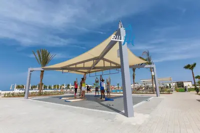 a large tent on a beach with people in it at Hotel Riu Karamboa - Adults Only - All Inclusive in Rabil
