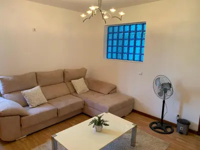 a living room with a couch and a table at Kaza Awa - Urban Guesthouse in Praia