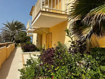 a building with a bunch of plants in front of it at Raio Do Sol - Beach front studio with city view in Santa Maria