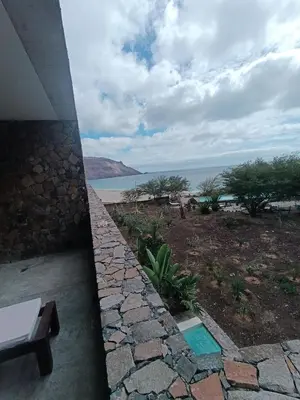 a view of the ocean from the balcony of a house at São Pedro Bay in Mindelo