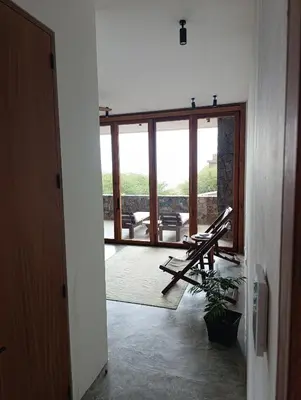 a hallway with a view of a living room at São Pedro Bay in Mindelo