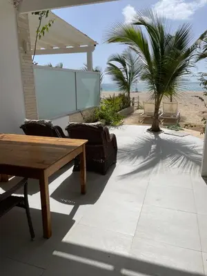 a screen in a patio with a table and chairs at Villa Alfredo Marchetti 13B in Cabeçadas