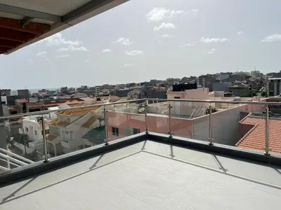 a balcony with a view of a city at Apto Duarte quarto no terraço in Praia