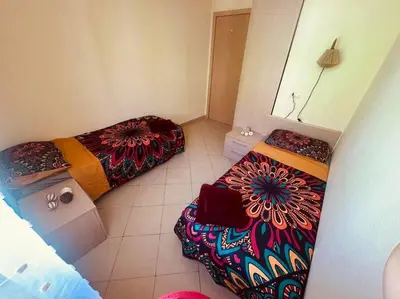 a room with two beds in a room with at appartement by seb in Santa Maria