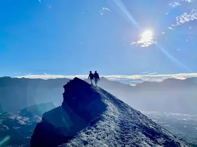 two people standing on top of a mountain at TCHAN LOVe in Portela