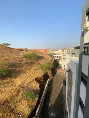a view of a hill from a building at Felicidade apartamento Palmarejo Grande in Praia