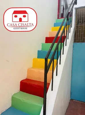a set of colorful stairs with a bus sign on the wall at Casa Cisalta N5 - Quarto Casal in Praia