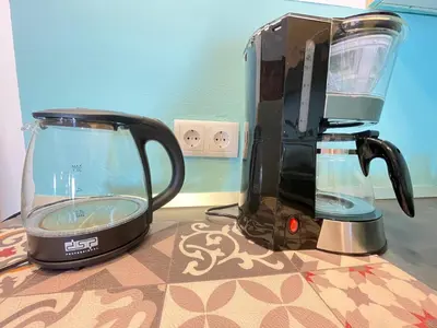 a blender sitting on top of a counter next to at Porto Antigo 2 studio 15 beach and pool in Santa Maria