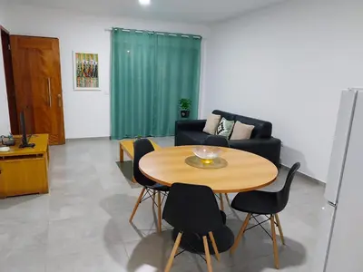 a living room with a table and a couch at Tity Apartments T2 in Santa Maria
