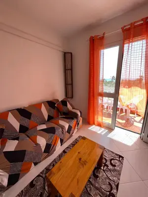 a living room with a couch and a coffee table at Soleado 9 in Santa Maria