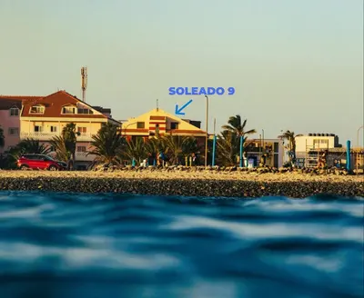 a view of a beach with a hotel in the background at Soleado 9 in Santa Maria