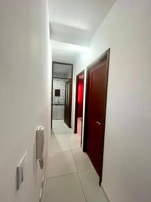 a hallway with two doors and a hallway with a tile floor at Oásis de retour in Ponta do Sol