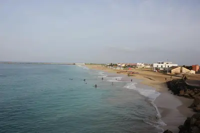 an aerial view of a beach with people in the water at Joli et fonctionnel proche centre et plage in Vila do Maio