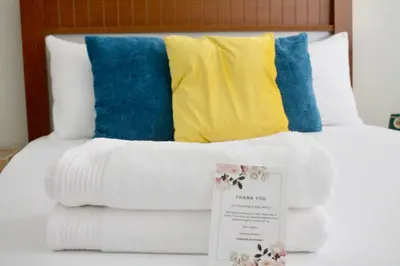 a pile of towels sitting on top of a bed at KANDAKE APARTMENT II Sal Rei Wi-fi in Sal Rei