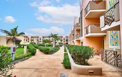 a walkway in front of a apartment building at Tropical African Vibe in Santa Maria