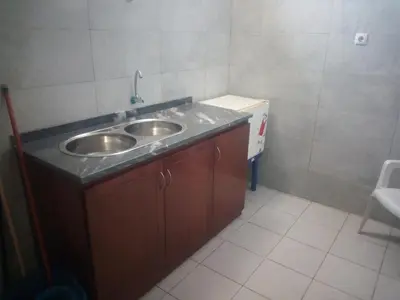 a small bathroom with a sink and a counter at Bar Residencial Frontera in Mindelo