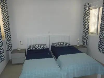 two beds sitting next to each other in a bedroom at Vila Cabral 2 Apartments - AC in Sal Rei