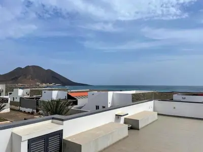a view of the ocean from the roof of a building at Beach House in Calhau