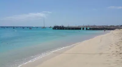 a view of a beach with a pier in the water at 2Bed-Vila-Verde Sal Cape Verde-Balcony-Pool in Santa Maria