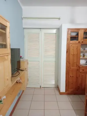 a room with a door and a tiled floor at Holiday Maio in Calheta Do Maio