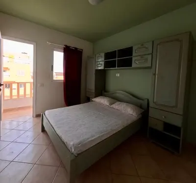 a bedroom with a bed in a room with a window at Ca' Ale in Santa Maria