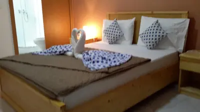 a bedroom with a bed with towels on it at LT Aparthotel in Praia