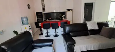 a living room with a couch and a table at Liminha Guest House in Calheta de São Miguel
