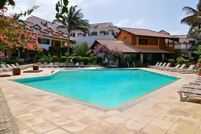 a swimming pool in front of a house at Porto Antigo II Ocean Appartment in Santa Maria