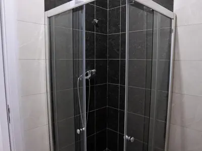 a shower with a glass door in a bathroom at Casabeleza Cape Verde in Assomada