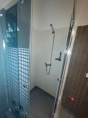 a shower with a glass door in a bathroom at Blu Jasmine in Sal Rei