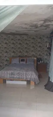 a bedroom with a bed in a room at Casa Mamã in Portela