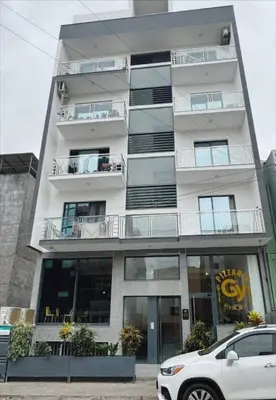 a white car parked in front of a building at Peace of mind in Praia