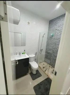 a bathroom with a shower and a toilet and a sink at Peace of mind in Praia