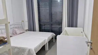 a hospital room with two beds and a window at Casa Maré & Museu - Porta Nº 18 in Mindelo