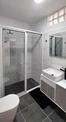 a bathroom with a shower and a toilet and a sink at Apartment Boadventure in Sal Rei