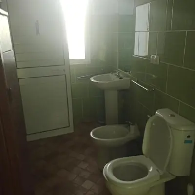 a bathroom with a toilet and a sink at Ca Azul in Tarrafal