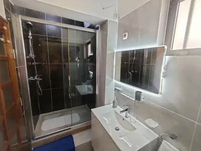 a bathroom with a sink and a shower at brISA in Praia