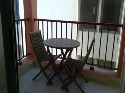 a table and two chairs sitting on a balcony at Casa Sara Boavista in Sal Rei