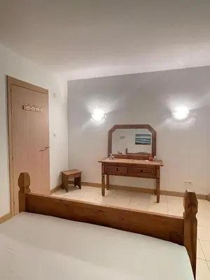 a dressing room with a mirror on the wall at Suíte Deluxe Soares in Prainha