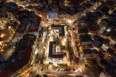 an aerial view of a city at night at 1 bdr cozy central apt in Praça Center - LCGR in Praia