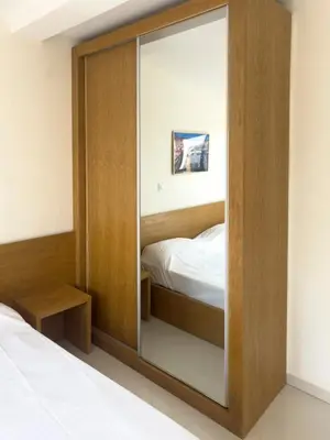 a large mirror in a bedroom with a bed at 1 bdr cozy central apt in Praça Center - LCGR in Praia